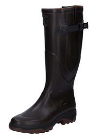 Botte en caoutchouc brune, montée jusqu'au genou, avec une surface extérieure texturée, une semelle robuste, une sangle ajustable et un détail de logo en haut.