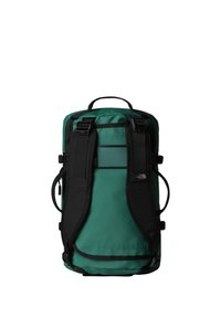Green and black backpack with a roll-top design, adjustable straps, mesh accents, and side pockets for organization. Durable material.