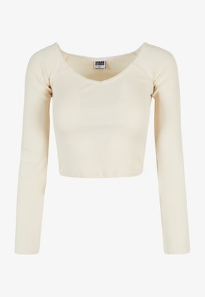 Langarmige, geribbelde cropped top in crèmekleur met een ronde hals, met het label Urban Classics in maat XS.