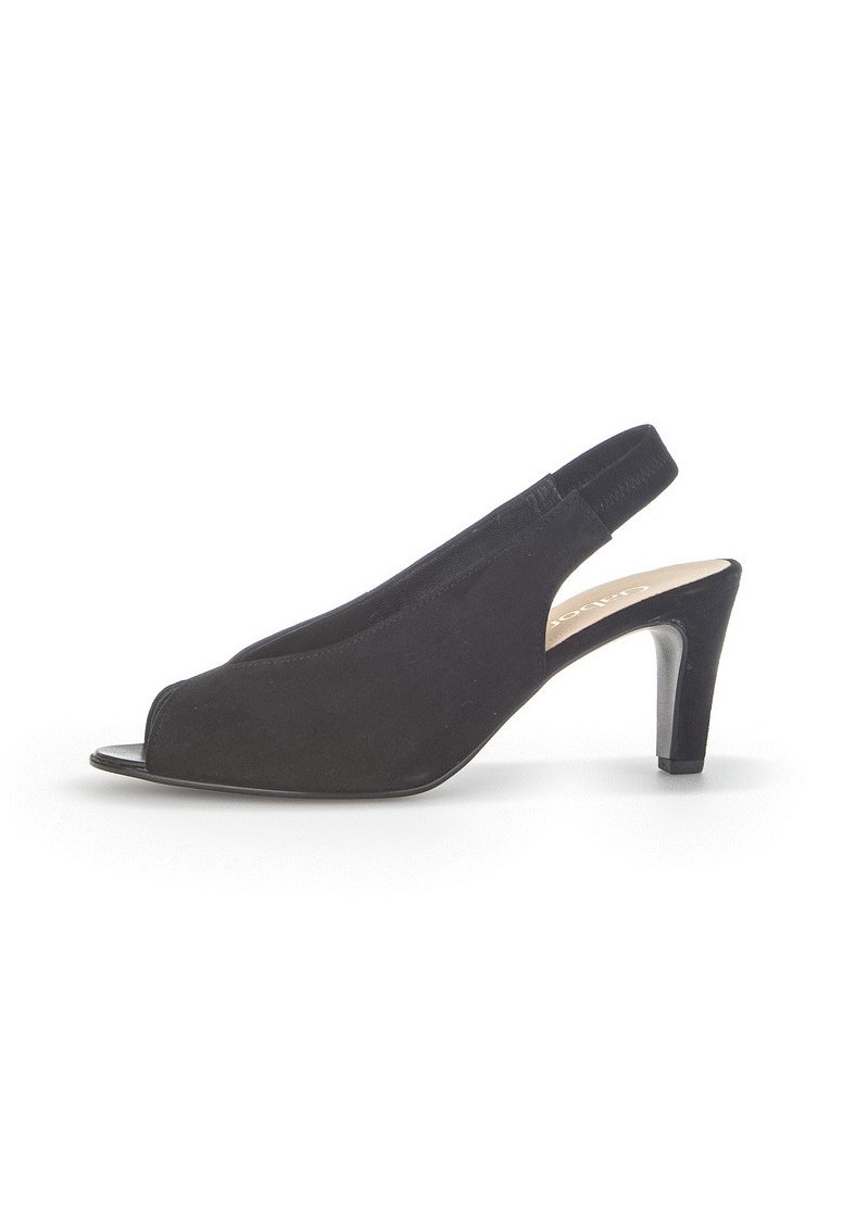 Black suede slingback shoe with open toe, low heel, and smooth texture. Features a strap at the back for secure fitting.