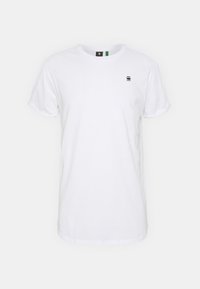 Vit bomull t-shirt med korta ärmar, rund halsringning och en liten svart logotyp på bröstet. Slät textur, klassisk passform.