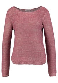 Pull en maille rose avec une coupe ample, col rond et manches longues. Tissu texturé avec un motif discret et ourlet et poignets côtelés.