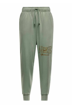 Pantaloni della tuta verdi con vita elasticizzata e cordoncino regolabile. Presentano un grande logo Nike ricamato in oro sulla gamba sinistra.