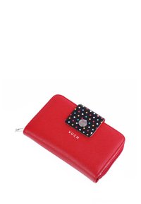 Red wallet with a textured finish, featuring a black flap with colorful polka dots and a silver snap button. "VUCH" logo displayed.