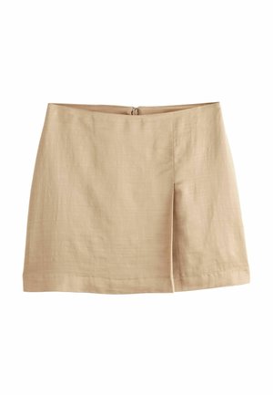 Beige linen mini skirt with a front center pleat and a back zipper closure, displayed on a white background.