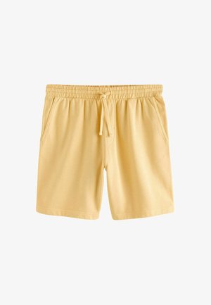 Shorts décontractés jaune clair avec taille élastique, cordon de serrage ajustable et poches latérales, présentés sur fond blanc.