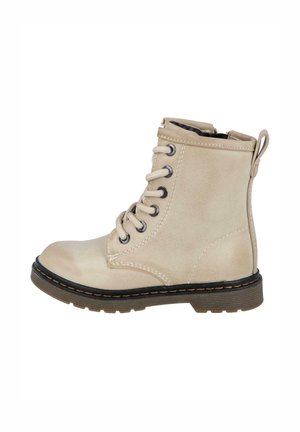 Botín de tobillo de imitación cuero beige con cordones en la parte delantera, cremallera lateral, suela negra y costuras en contraste. Presenta una tirador en la parte posterior.