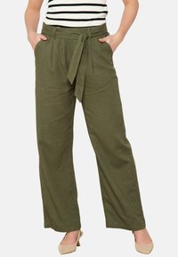 High-waisted, wide-leg pants in olive green, made of textured fabric. Features a tie at the waist and side pockets.