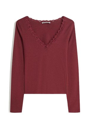 Tricou lung maron cu decolteu în formă de V, având o margine din dantelă cu model ondulat. Material moale, cu un design ajustat și slituri laterale la tiv.