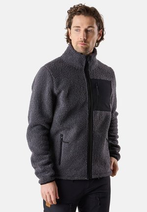 Grey fleece jacket with high collar, black zippered chest pocket, and side pockets. Soft texture, relaxed fit, and long sleeves.