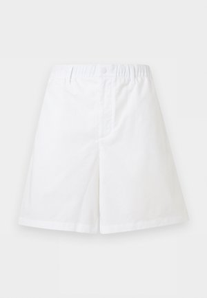 Bílé šortky s elastickým pasem, zapínáním na patentní knoflík a jednobarevným, volným střihem.