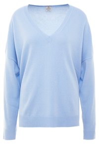 Ljusblå v-ringad tröja tillverkad av mjukt tyg, med ribbade muddar och fåll, i en avslappnad passform och med sjunkna axlar.