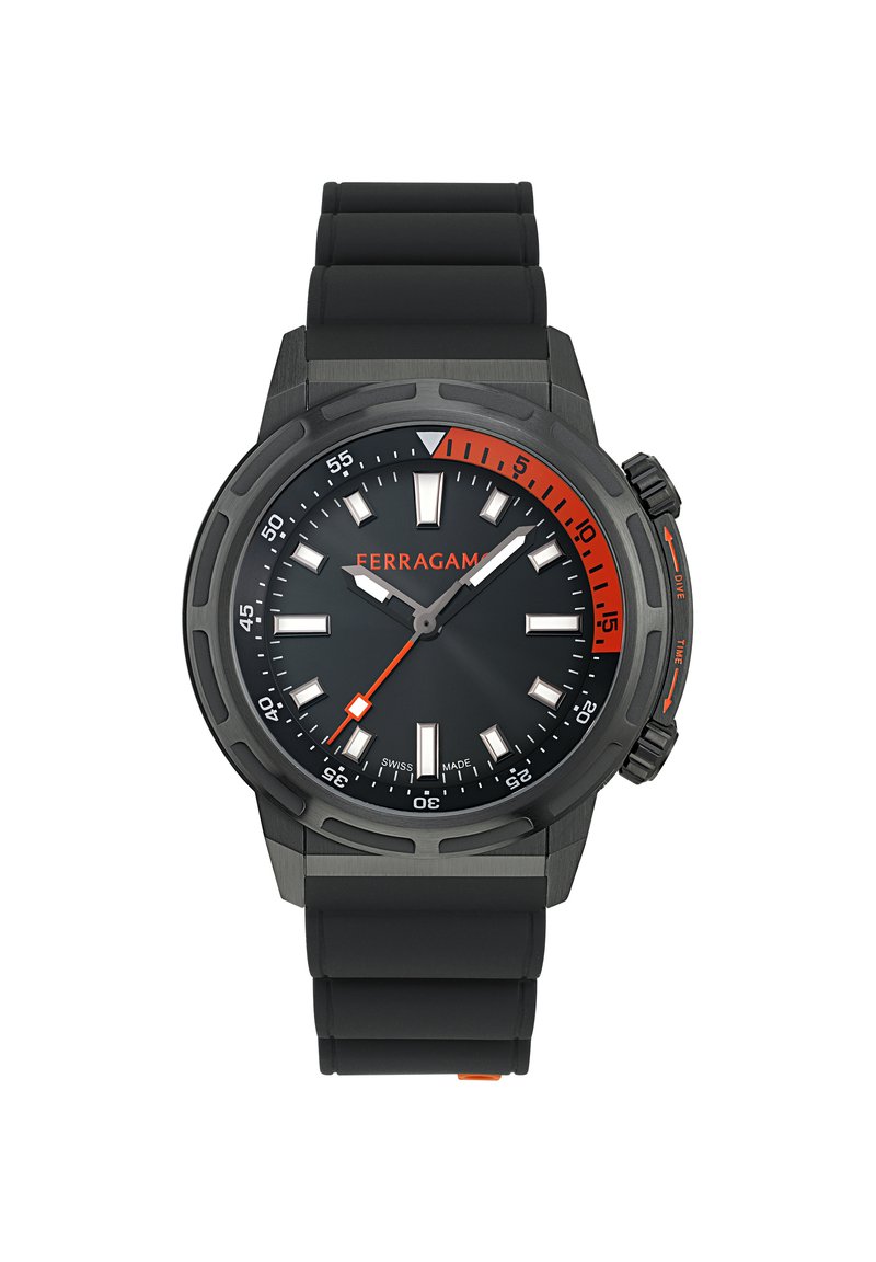 Black rubber strap watch with a round black dial. Features orange accents, luminous hour markers, and a date window at 6 o'clock.