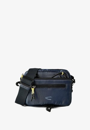Borsa a tracolla compatta blu navy con tracolla nera regolabile, molteplici scomparti con zip e cordoncini gialli sugli zip.