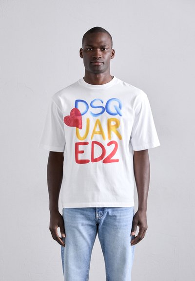 White cotton t-shirt featuring bold, colorful letters "DSQ JAR ED2" in red, blue, and yellow. Short sleeves and a relaxed fit.