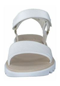White open-toe sandals with textured upper straps and a smooth beige footbed. Features adjustable gold hardware and a white rubber sole.