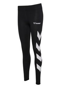 Leggings de sport noirs avec des bandes chevrons blanches sur le côté et le logo "hummel" près de la taille sur la jambe droite.