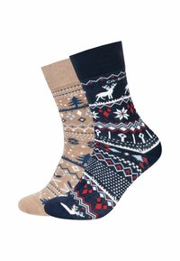 Calzini lavorati a maglia in beige e blu navy. Il lato beige presenta motivi di alberi e fiocchi di neve; il lato blu navy mostra renne e disegni geometrici.