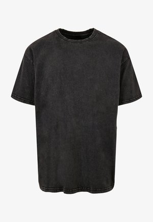 Fekete pamut póló rövid ujjakkal, kerek nyakkivágással és laza fazonnal. Halvány textúrával és látható varrási részletekkel rendelkezik az illesztéseknél.