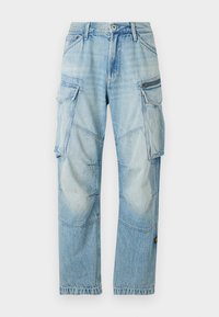 Ανοιχτό μπλε τζιν cargo παντελόνι με πολλαπλές τσέπες, ίσια γραμμή, ορατές ραφές και μια μικρή λεπτομέρεια με παύλα στο πλάι.