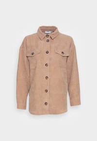Cord-Hemd in Hellbraun mit Kragen, zwei Brusttaschen und dunklen Knöpfen. Lange Ärmel und lockere Passform.