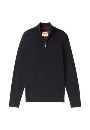 Tume mere pullover, millel on lukuga krae, ribitud tekstuur, sobivad varrukad ja kontrastne sisemine vooder. Silt on nähtav äärtes.