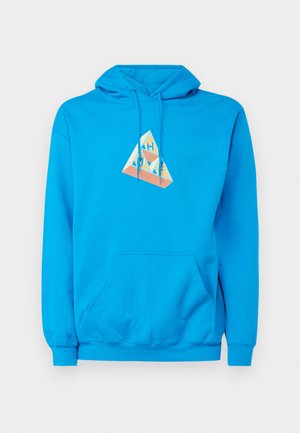 Blue hoodie with a kangaroo pocket, featuring a geometric graphic in cream and coral tones at the center. Cotton material, drawstring hood.