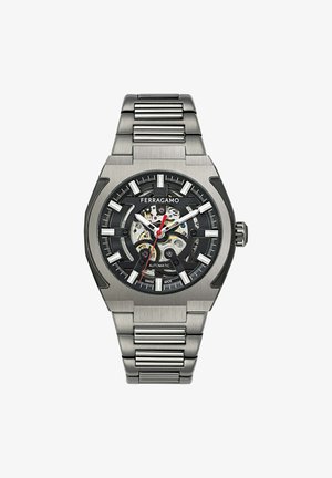 Ferragamo automatische horloge met een zwarte wijzerplaat, zilveren uurmarkeringen en een transparante achterkant. Beschikt over een roestvrijstalen band en een hoekig kastontwerp.