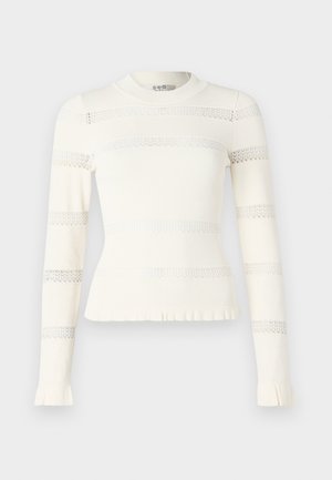 Kremowy sweter z długim rękawem o fakturze prążkowanej, z poziomymi koronkowymi paskami. Dopasowany krój z falbankami na dole i przy mankietach.