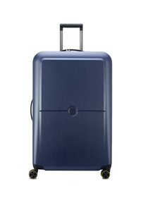 Valigia rigida blu navy con una texture liscia, angoli arrotondati, doppie ruote e un manico estensibile. Dotata di un meccanismo di chiusura centrale.