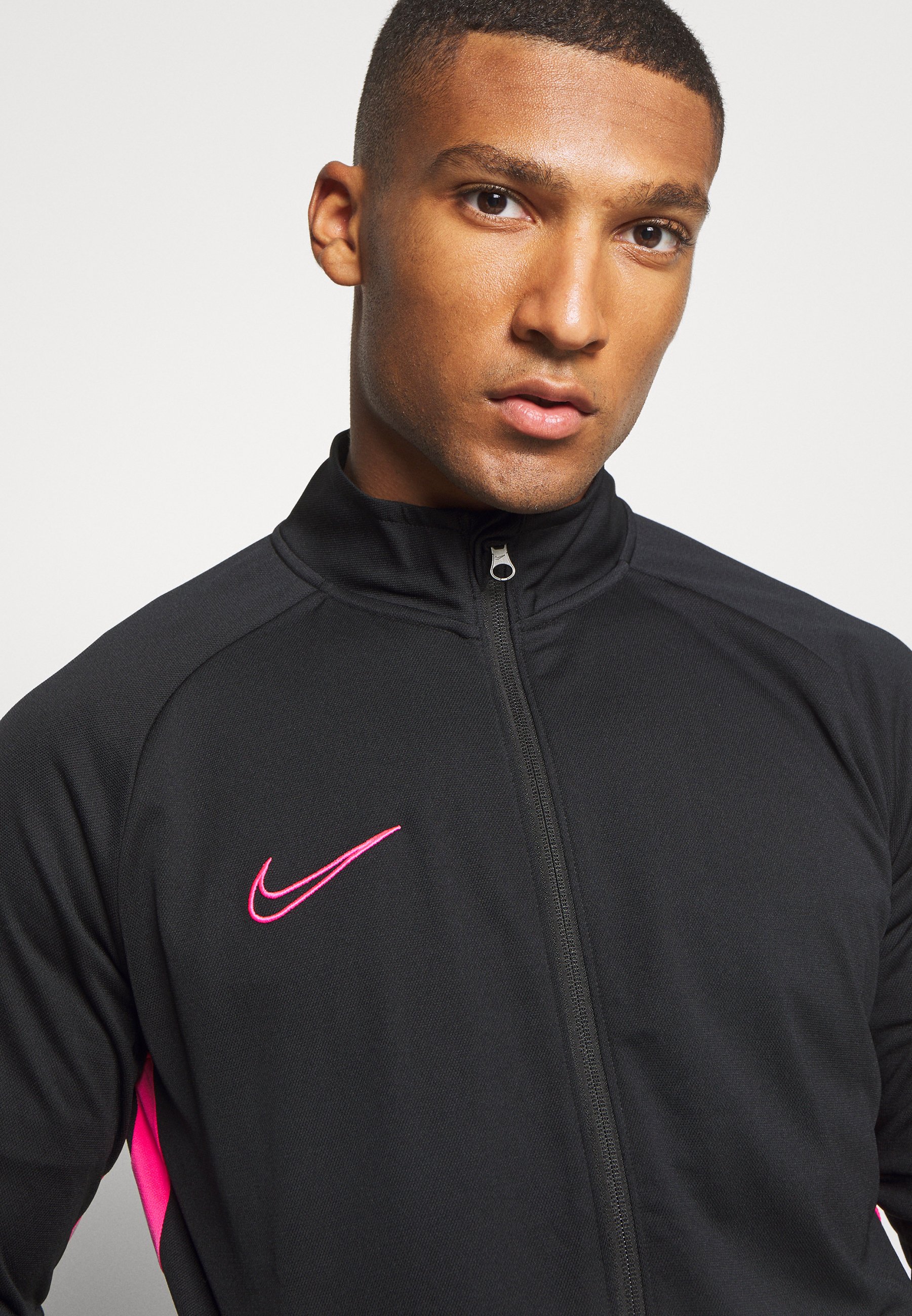 pink and black nike tracksuit
