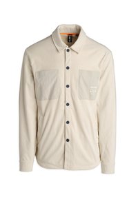 Beige corduroy shirt met een verhoogde textuur, twee opgestikte zakken, zwarte knopen en een oranje accent aan de binnenkant van de kraag.