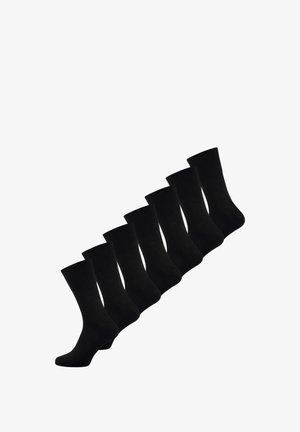 Set aus sieben schwarzen Baumwollsocken mit geripptem Bund, weicher Textur und knöchellangem Design. Einheitliche Farbe und Stil durchgehend.