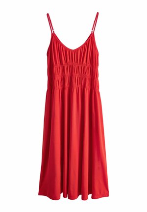 Rød ærmeløs kjole med justerbare spaghetti-stropper og samlet elastikdetalje over bryst og talje, der falder nedenfor knæet.