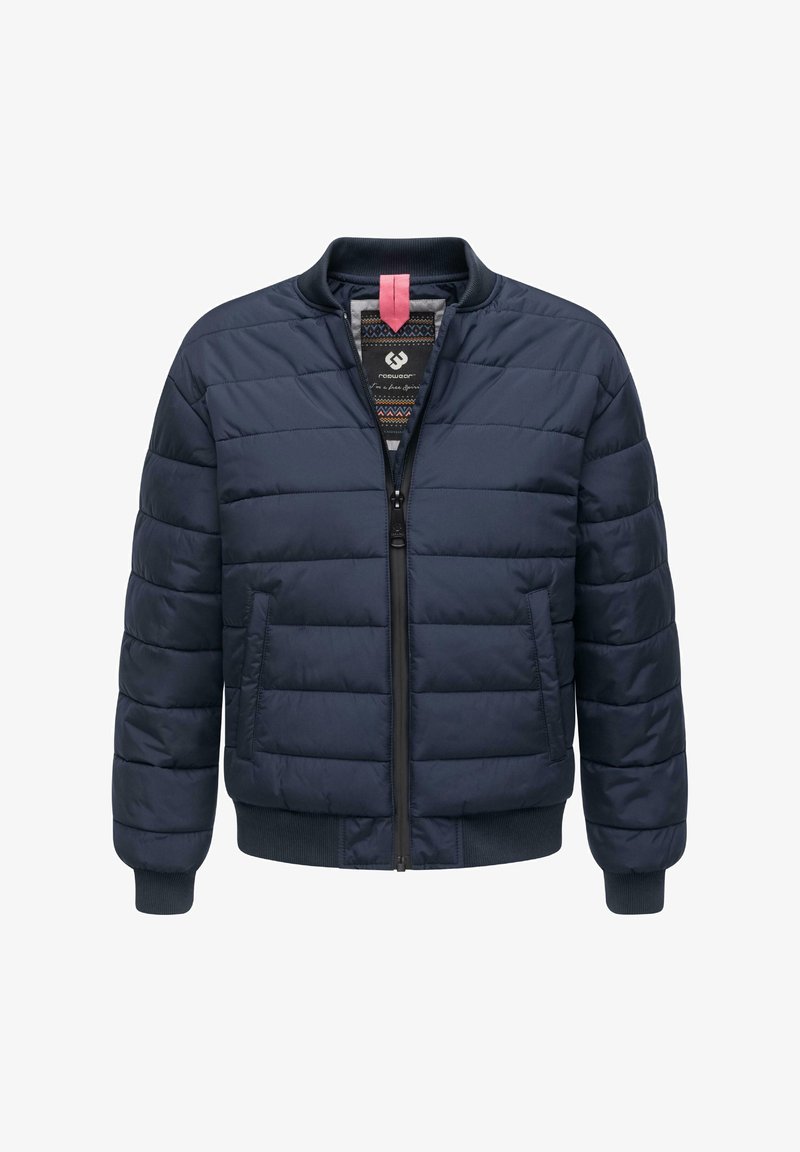 Tumesin tikkpühi jakk, millel on ees lukuga kinni minev, ribitud mansetid ja krae. Omab kontrastset sisepinda ja kahte külgtaskut.