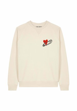 Cremfarbener Sweatshirt mit rundem Halsausschnitt. Hat ein rotes Herz und eine Sicherheitsnadel-Grafik auf der linken Brust. Weiches Material, gerippte Bündchen.