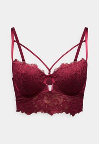 Burgundin väriinen pitsinen bralette, jossa on kukkakuosiset, pehmustetut kupit, keskiosan leikkaus yksityiskohtana ja säädettävät satiiniremmit. Teksturoitu pinta.