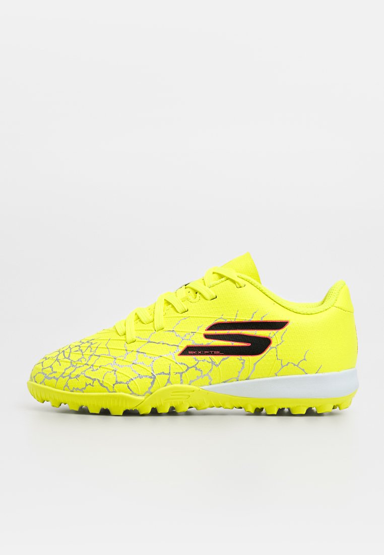 Neon-gelbe Fußballschuhe mit einem Rissmuster, schwarzen Akzenten und strukturiertem Obermaterial. Gummilaufsohle, die für Traktion auf Kunstrasen ausgelegt ist.