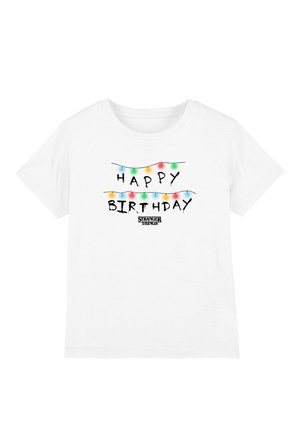 White cotton t-shirt featuring "HAPPY BIRTHDAY" in black script, decorated with colorful string lights and "STRANGER THINGS" text below.