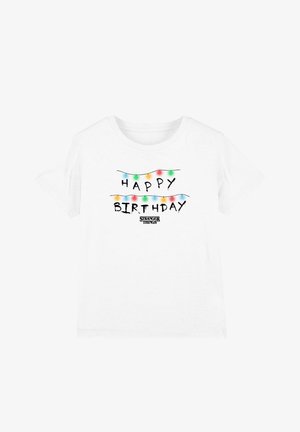 White cotton t-shirt featuring "HAPPY BIRTHDAY" in black script, decorated with colorful string lights and "STRANGER THINGS" text below.