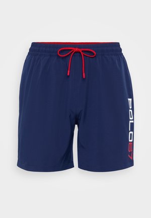 Navy swim shorts with a drawstring waist in red. Features the text "POLO67" in white and red along the left side. Smooth fabric texture.