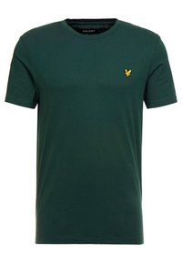 Dunkelgrünes Baumwoll-T-Shirt mit Rundhalsausschnitt, kurzen Ärmeln und einem kleinen gelben gestickten Logo auf der linken Brust. Glatte Textur.