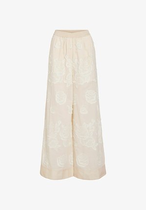 Kremfargede bukser med vide ben og elastisk midje, med et strukturert blomster mønster over hele stoffet.