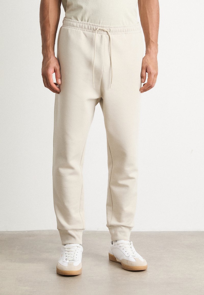 BOSS HADIKO - Spodnji deli trenirk - light beige