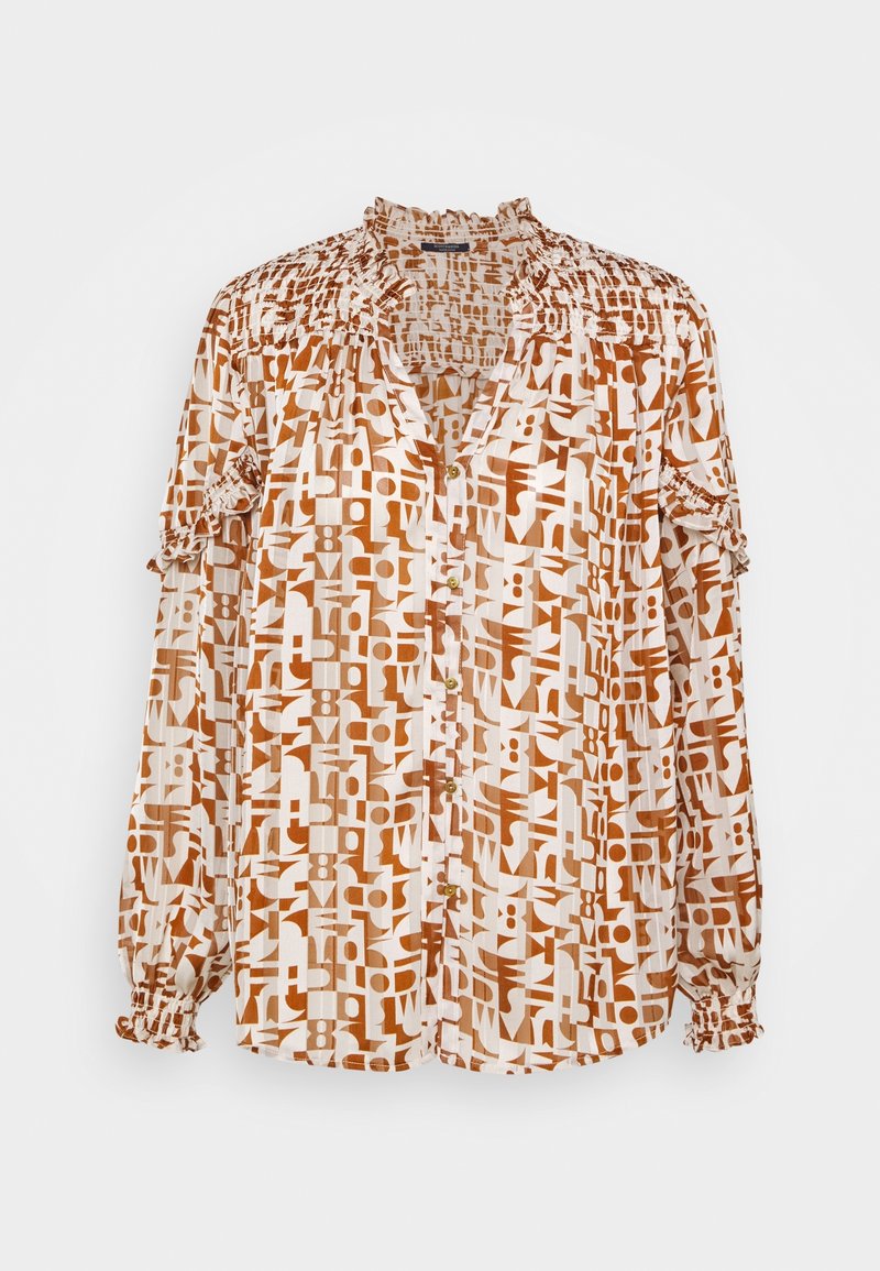 Blouse à manches longues en crème avec un imprimé géométrique en orange brûlé. Dispose d'une fermeture par boutons, de détails smockés sur les manches et d'un col à volants.