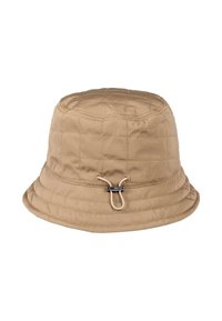 Beige quilted bucket hat with adjustable cord and black toggle on front, isolated on white background.