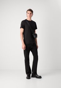 Calvin Klein Jeans TEXTURED MONOLOGO TEE - T-shirt med print - black