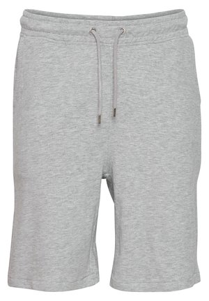 Grå bomuldsshorts med en blød tekstur, elastisk talje og snor. Har diskrete syninger og en længde, der stopper midt på låret.