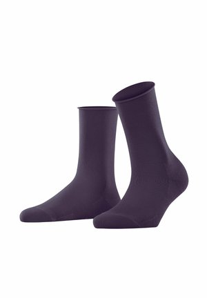 Chaussettes chevilles violettes avec une texture lisse, hauteur standard et zone de orteil renforcée. Fabriquées en tissu extensible et respirant.