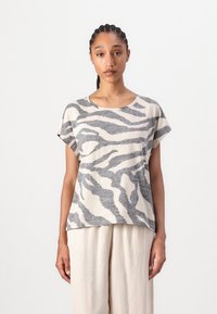 Haut clair à manches courtes, avec un motif rayé zébré dans des tons de gris, fabriqué à partir d'un tissu doux et texturé. Conception à coupe ample.